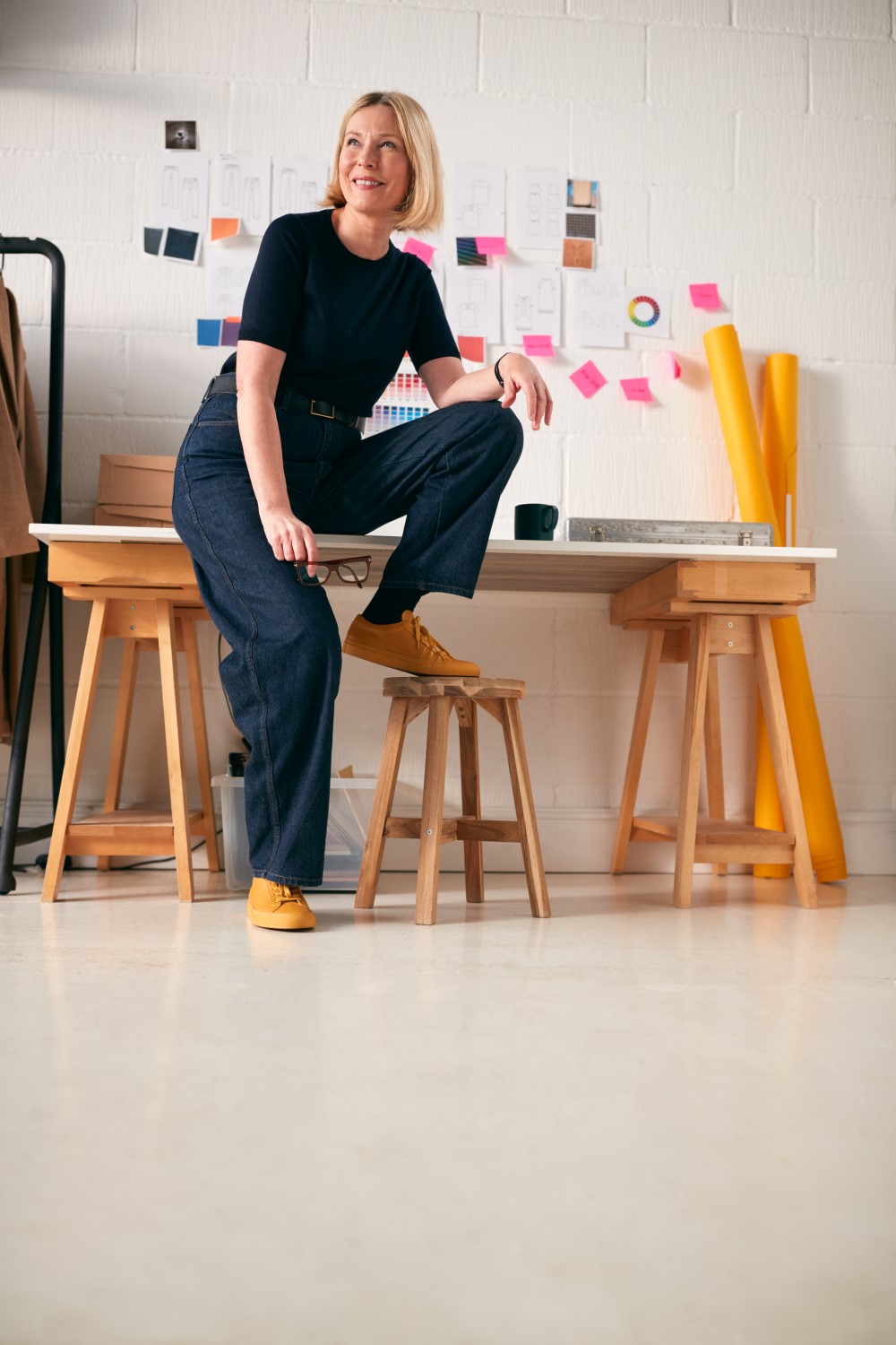 portrait-of-confident-mature-businesswoman-sitting-Y6QKVX82